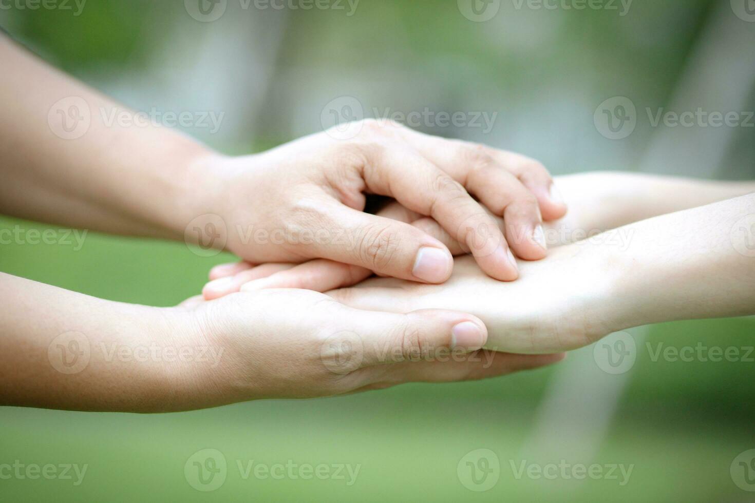 Couple lovers romantic holding hands towards with bright sun flare in public parks, or close up view in a conceptual image first love adolescent young relationship. lover photo