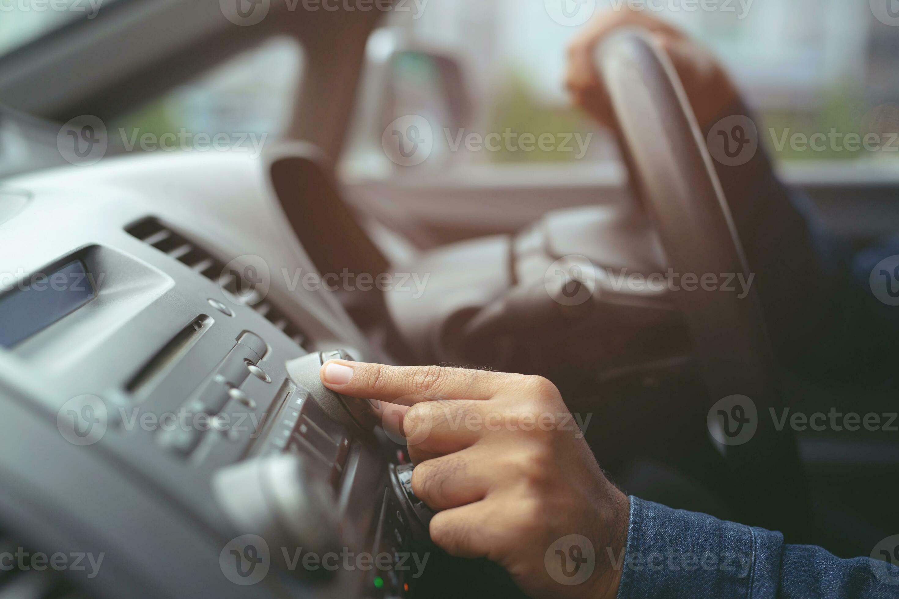 close up hand open car radio listening. Car Driver changing turning