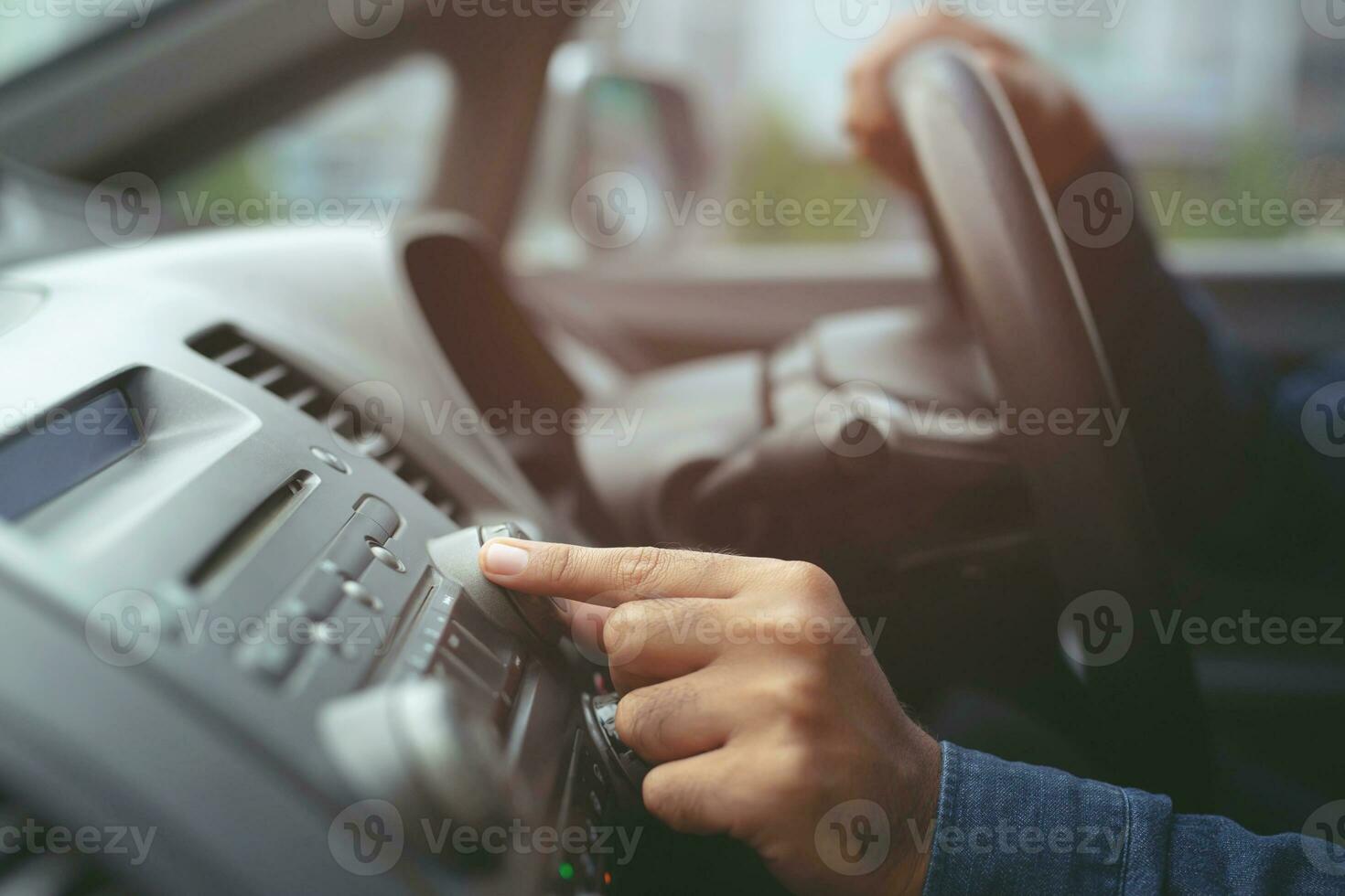 close up hand open car radio listening. Car Driver changing turning button Radio Stations on His Vehicle Multimedia System. Modern touch screen Audio stereo System. transportation and vehicle concept photo