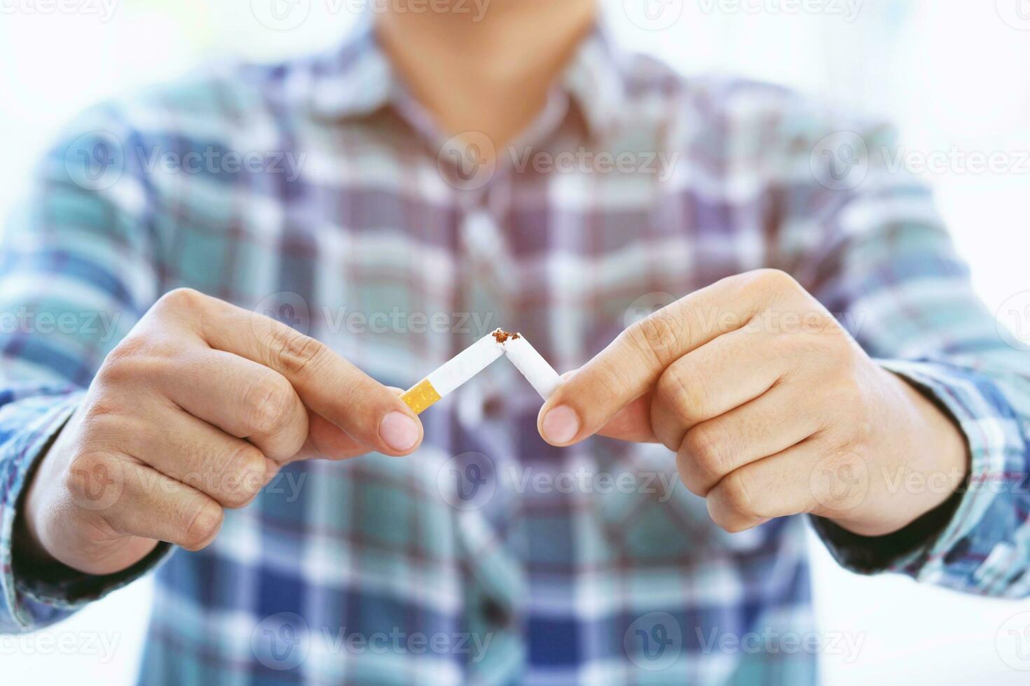 Man refusing cigarettes concept for quitting smoking and healthy lifestyle dark background. or No smoking campaign Concept. photo