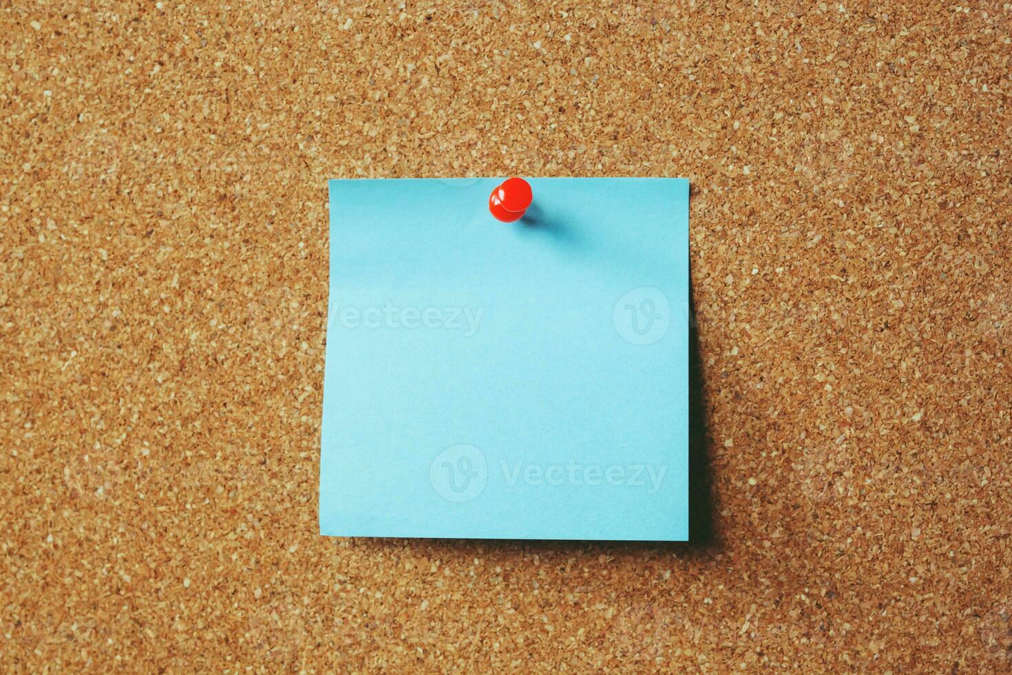 collection of colorful variety post it. paper note reminder sticky notes pin paper blue  on cork bulletin board. empty space for text. photo
