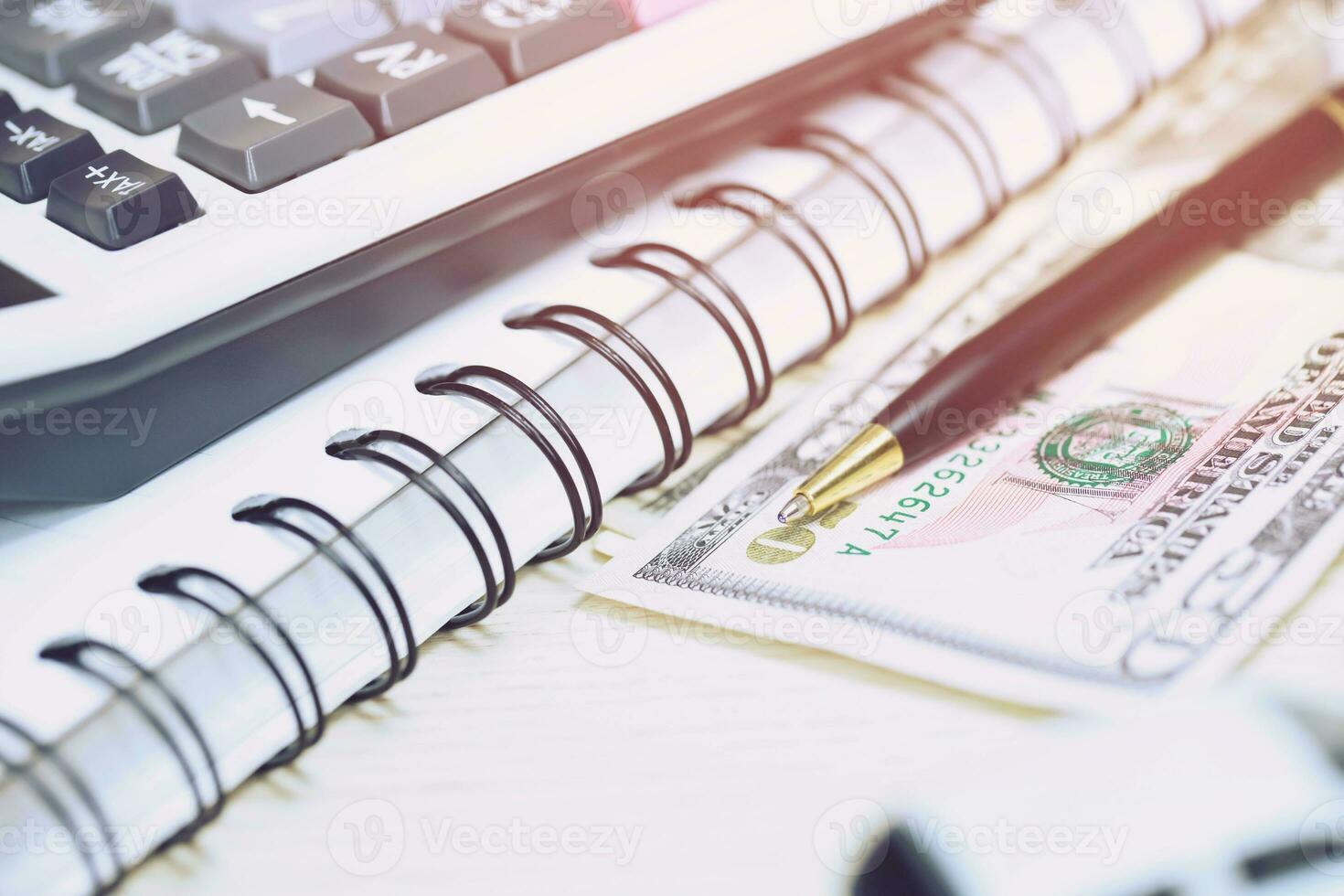 Office desk table calculator with notepad book, bank account and black pen. Top view with copy space. investment calculation Accounting, financial concept photo
