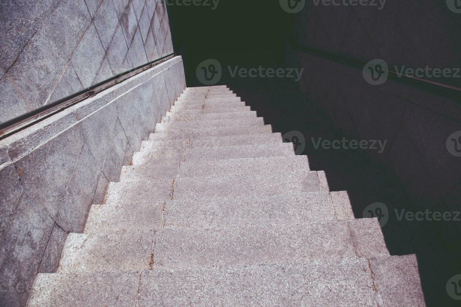 Stairs. subway staircase old in dark night secluded, concrete stairs in the city, stone granite stair steps often seen on monuments and landmarks, going down. Architectural details interiors photo