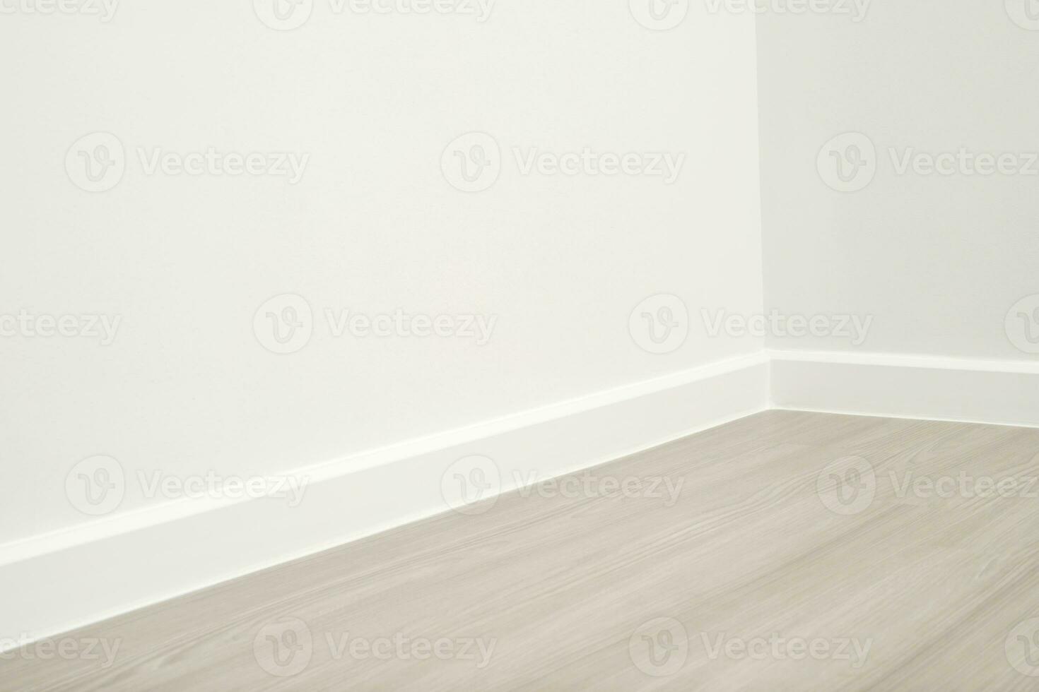 Wooden floors and beautiful white wall-mounted cornices in the house. photo