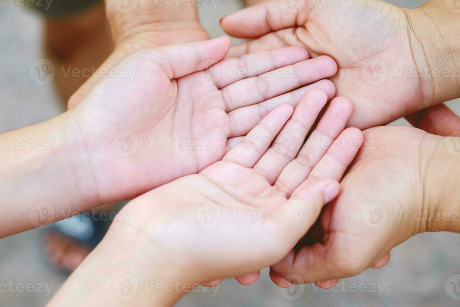 Children's hands with the warmth of mother's care photo
