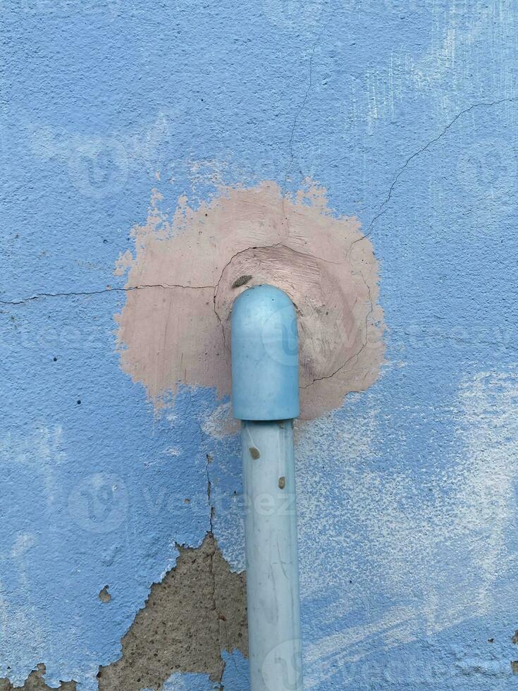 old pipe on the blue wall photo