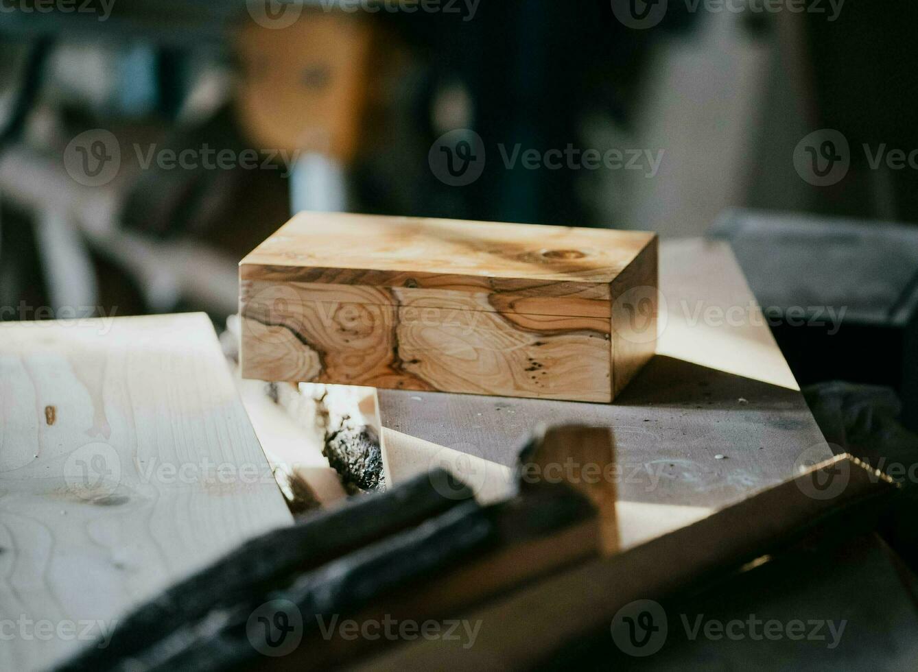 a wooden block sitting on top of a wooden table photo