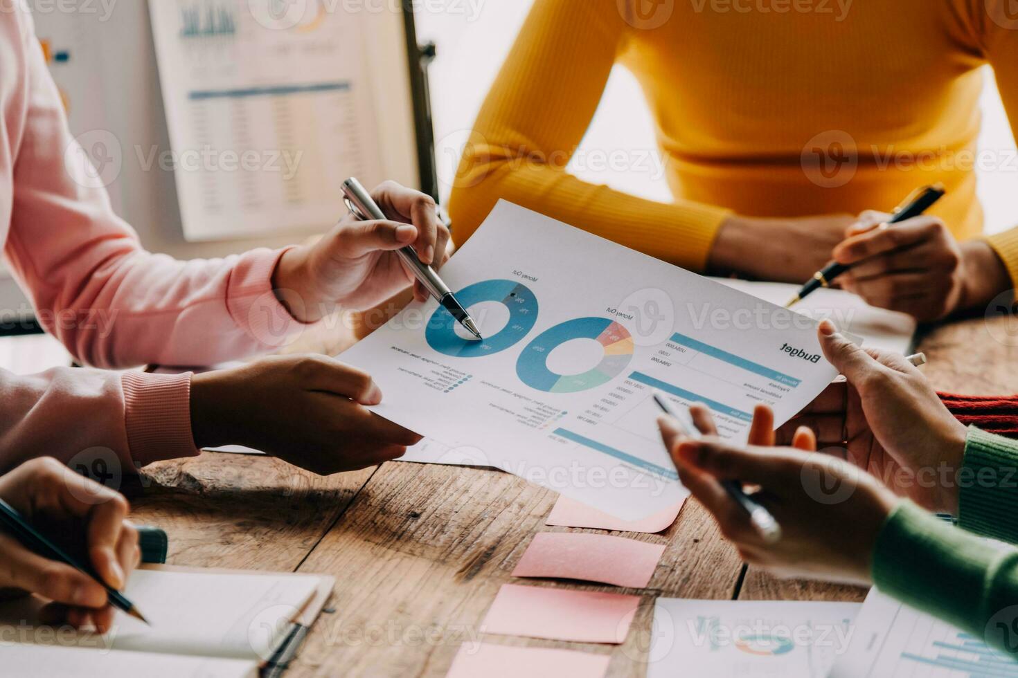 Brainstorming Collaboration and successful partnership analysis by Young business Asian people working in an office workspace photo