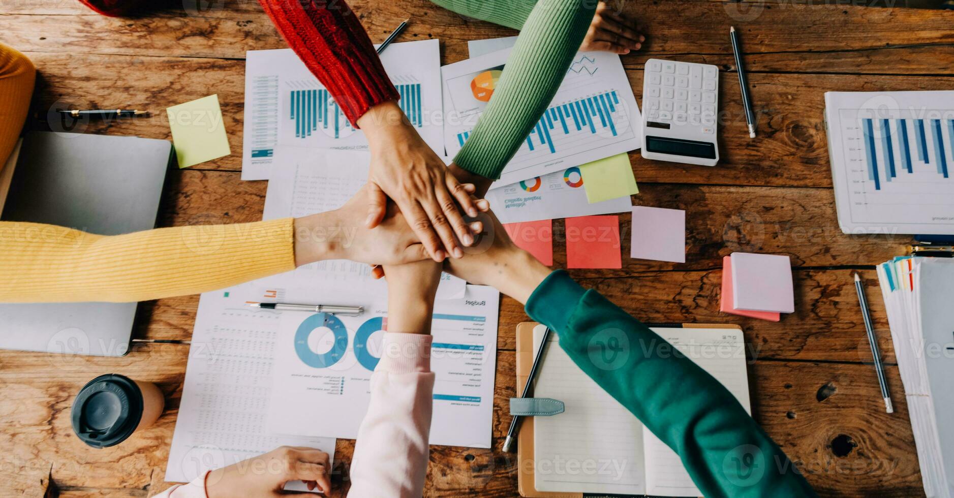Brainstorming Collaboration and successful partnership analysis by Young business Asian people working in an office workspace photo
