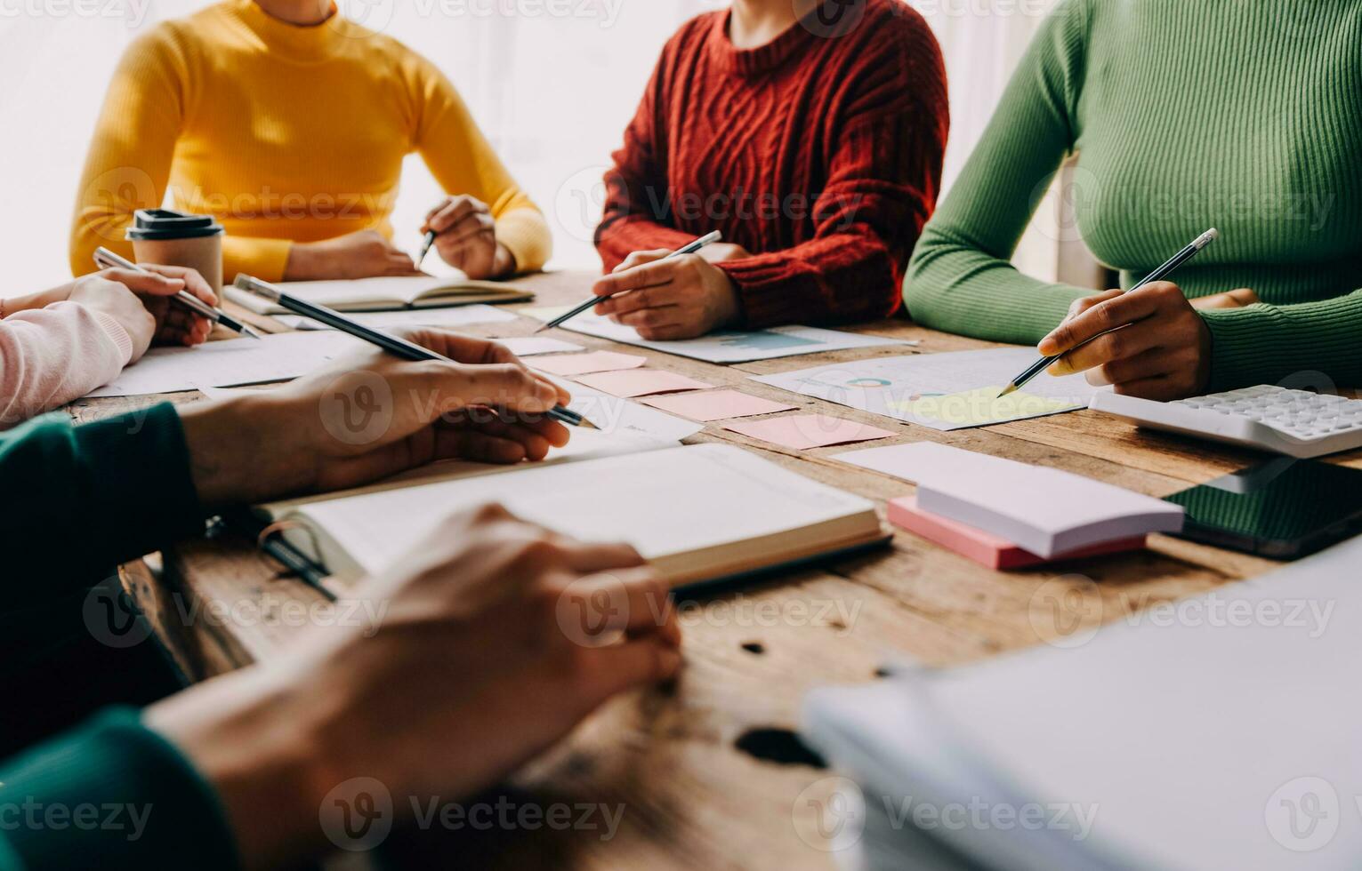 Brainstorming Collaboration and successful partnership analysis by Young business Asian people working in an office workspace photo