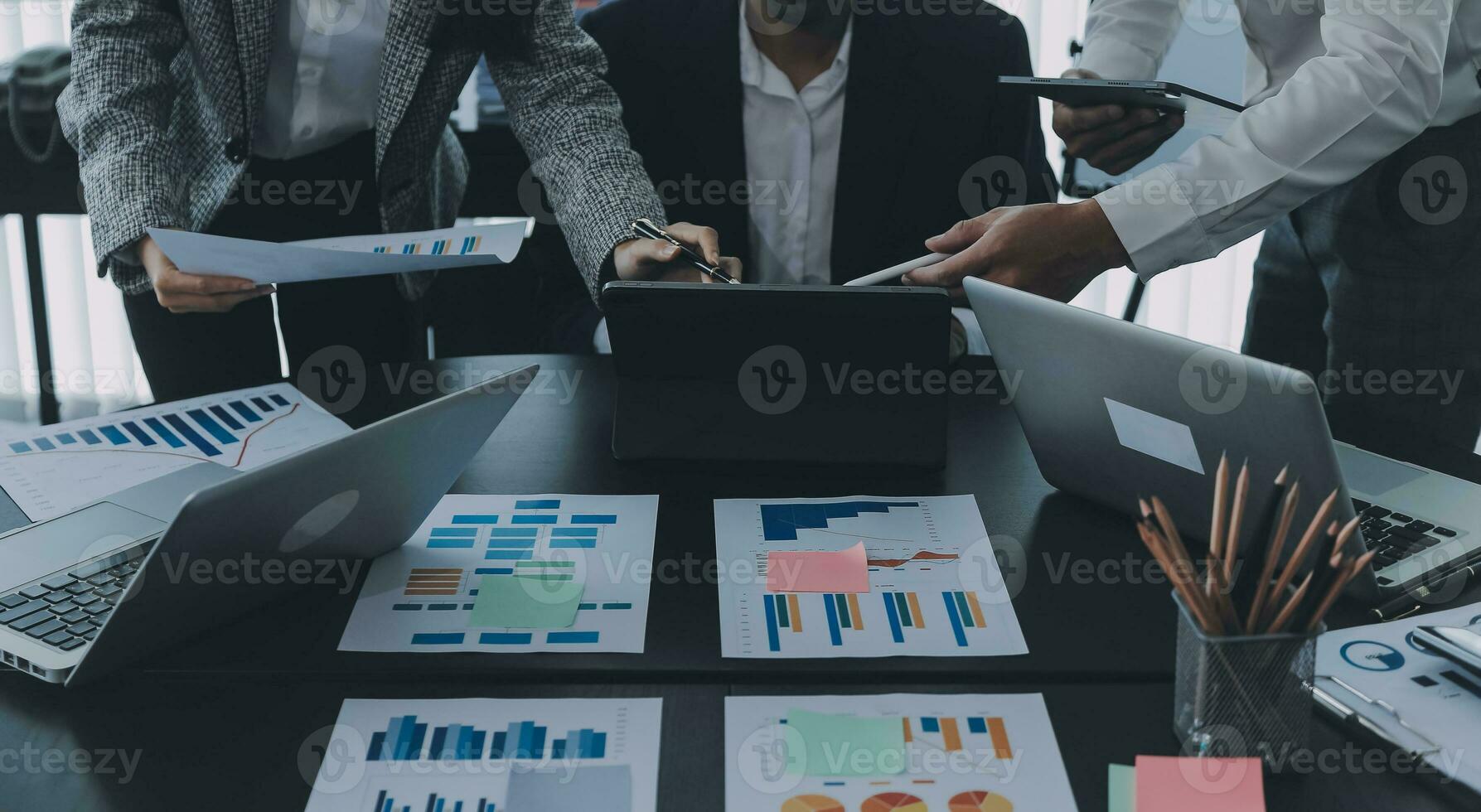 Close up of Business team analyzing income charts and graphs with modern laptop computer. Business analysis and strategy concept. photo
