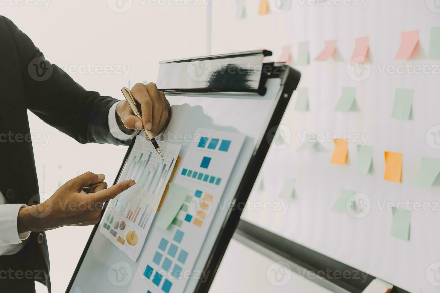 Business team working with new startup project plan and discussion information for financial strategy with laptop and digital tablet in a modern business lounge. photo