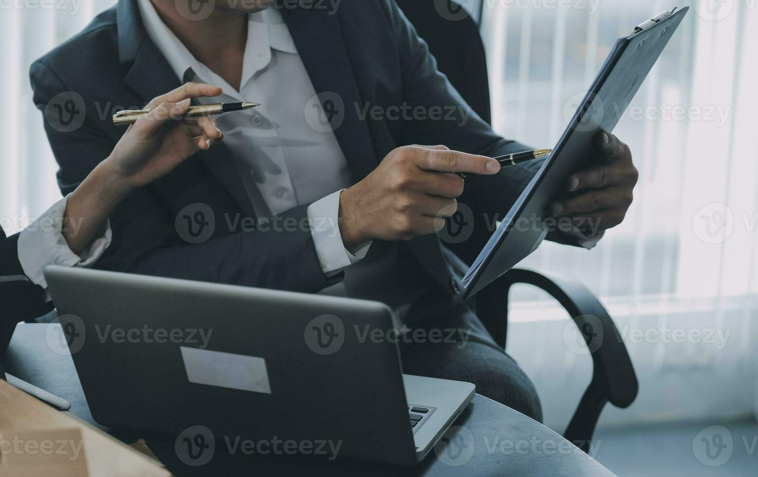 Close up of Business team analyzing income charts and graphs with modern laptop computer. Business analysis and strategy concept. photo