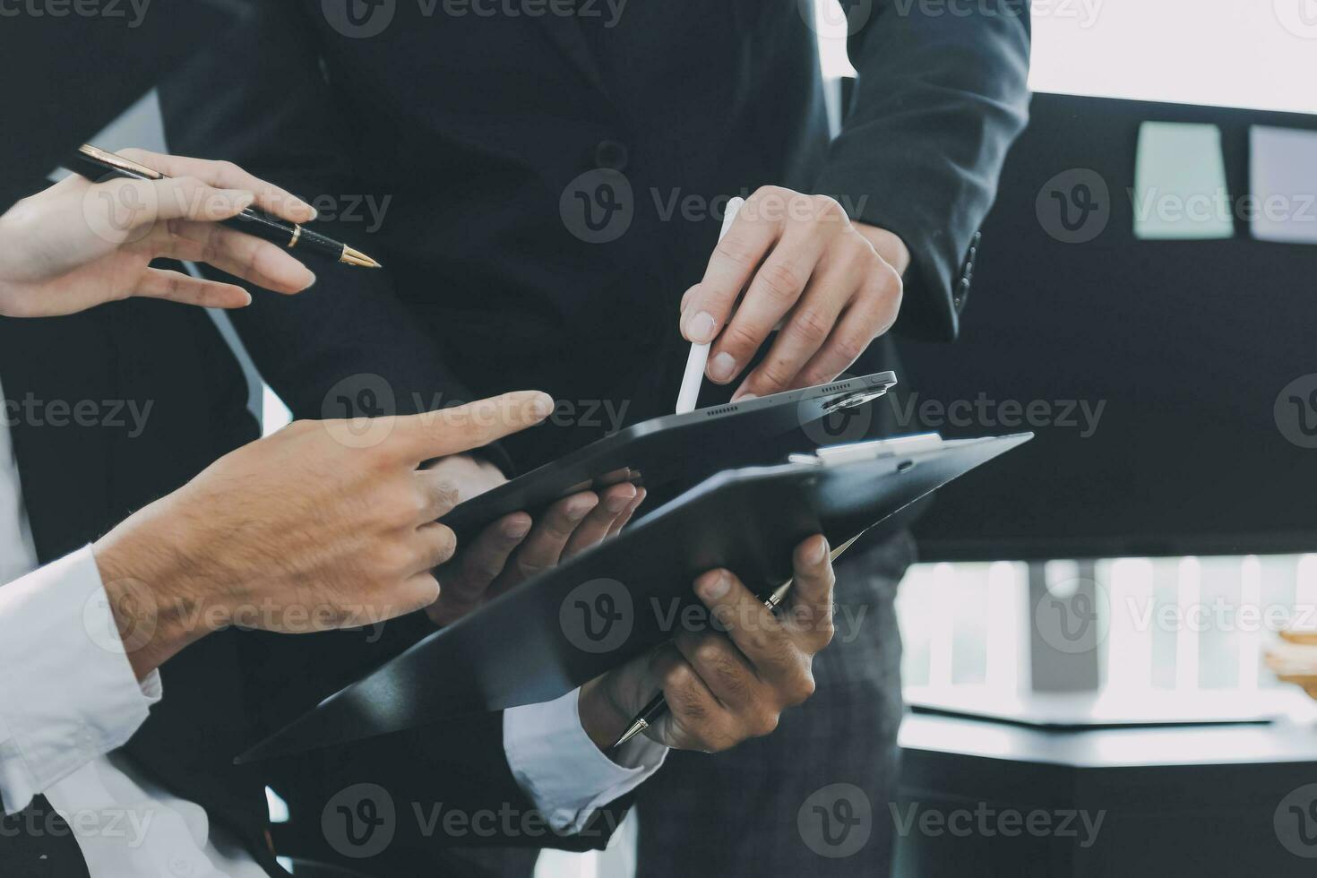 Business team working with new startup project plan and discussion information for financial strategy with laptop and digital tablet in a modern business lounge. photo
