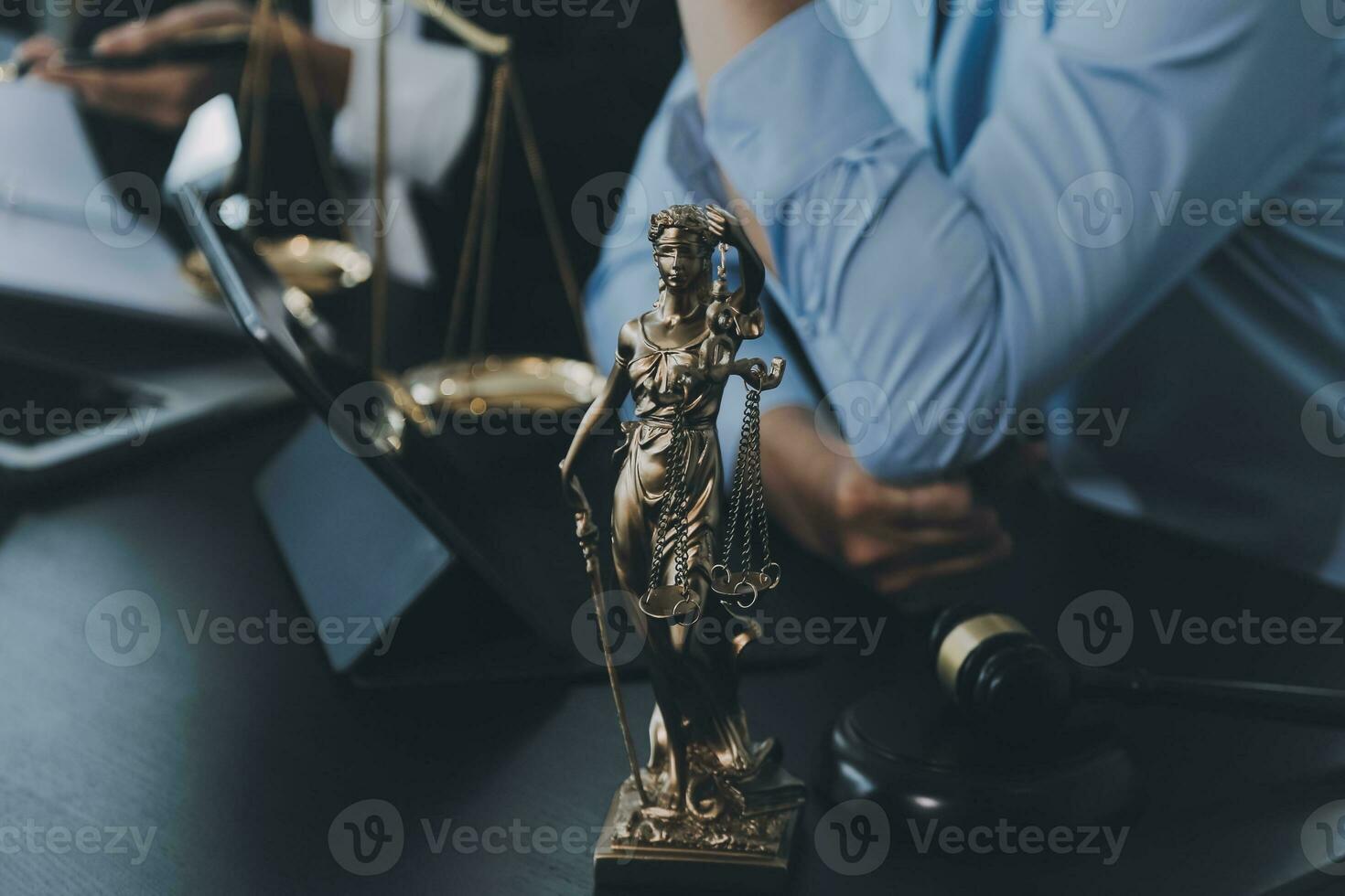 Business and lawyers discussing contract papers with brass scale on desk in office. Law, legal services, advice, justice and law concept picture with film grain effect photo