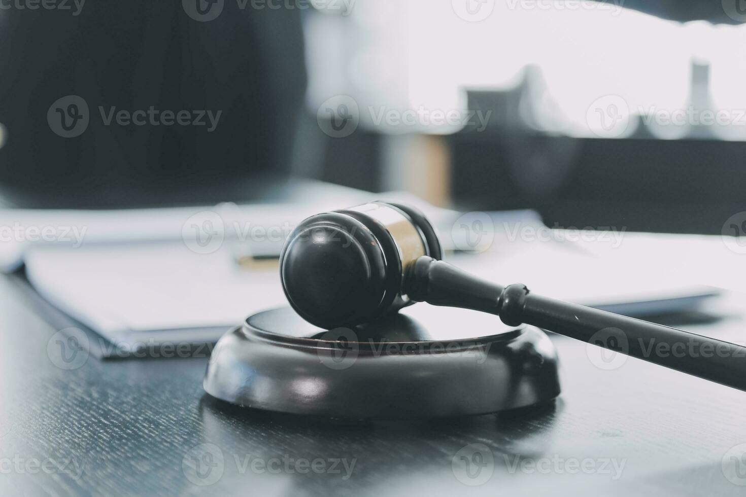 Business and lawyers discussing contract papers with brass scale on desk in office. Law, legal services, advice, justice and law concept picture with film grain effect photo