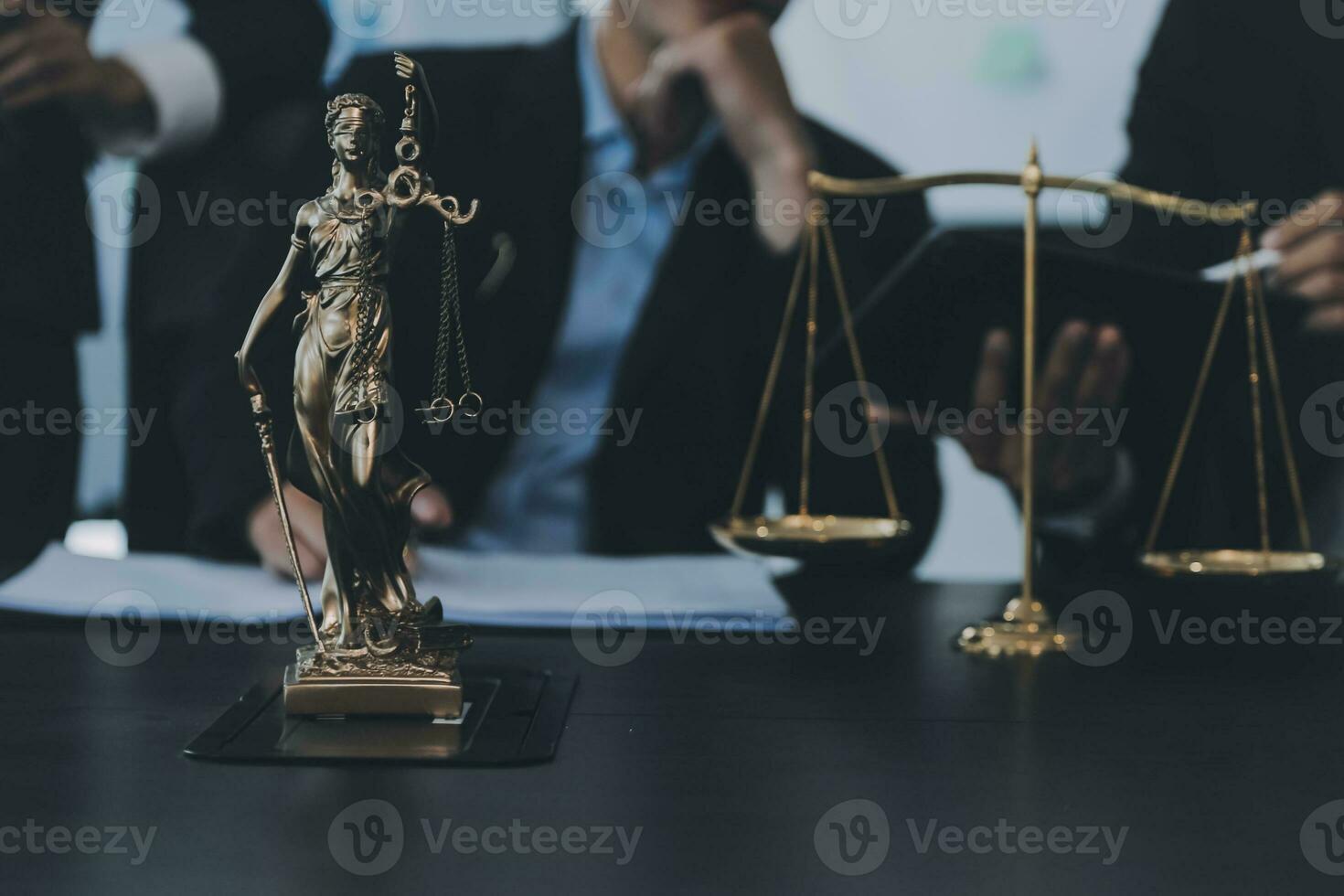 Business and lawyers discussing contract papers with brass scale on desk in office. Law, legal services, advice, justice and law concept picture with film grain effect photo
