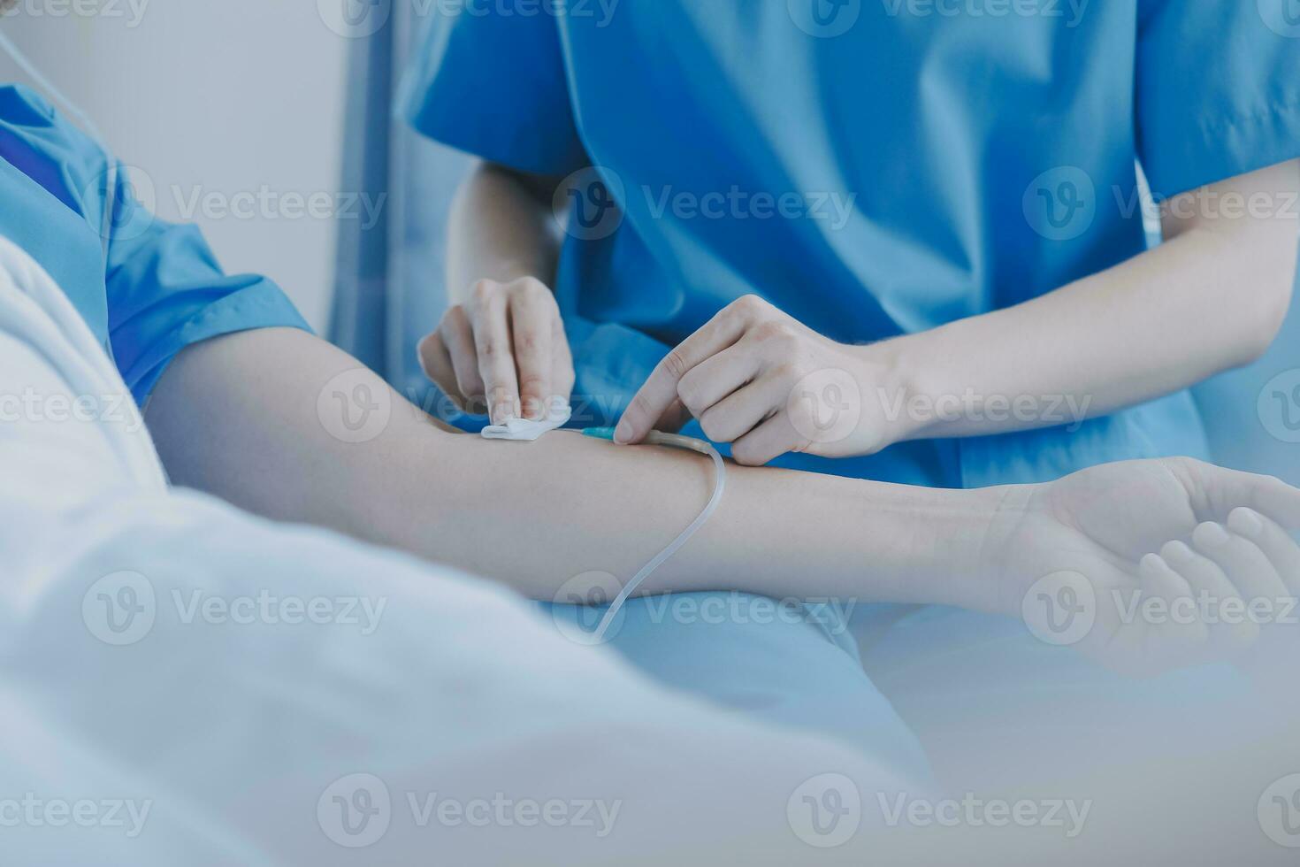 Injured patient showing doctor broken wrist and arm with bandage in hospital office or emergency room. Sprain, stress fracture or repetitive strain injury in hand. Nurse helping customer. First aid. photo