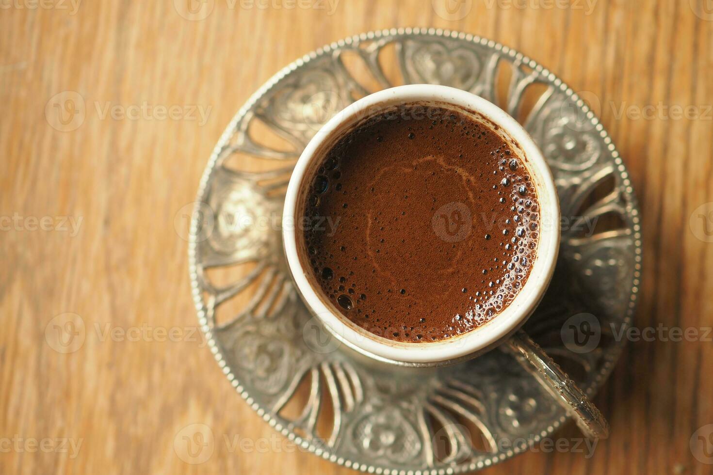 a cup of turkish coffee on table photo