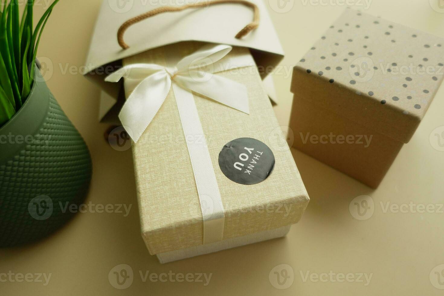 a thank you sticker on a gift box photo