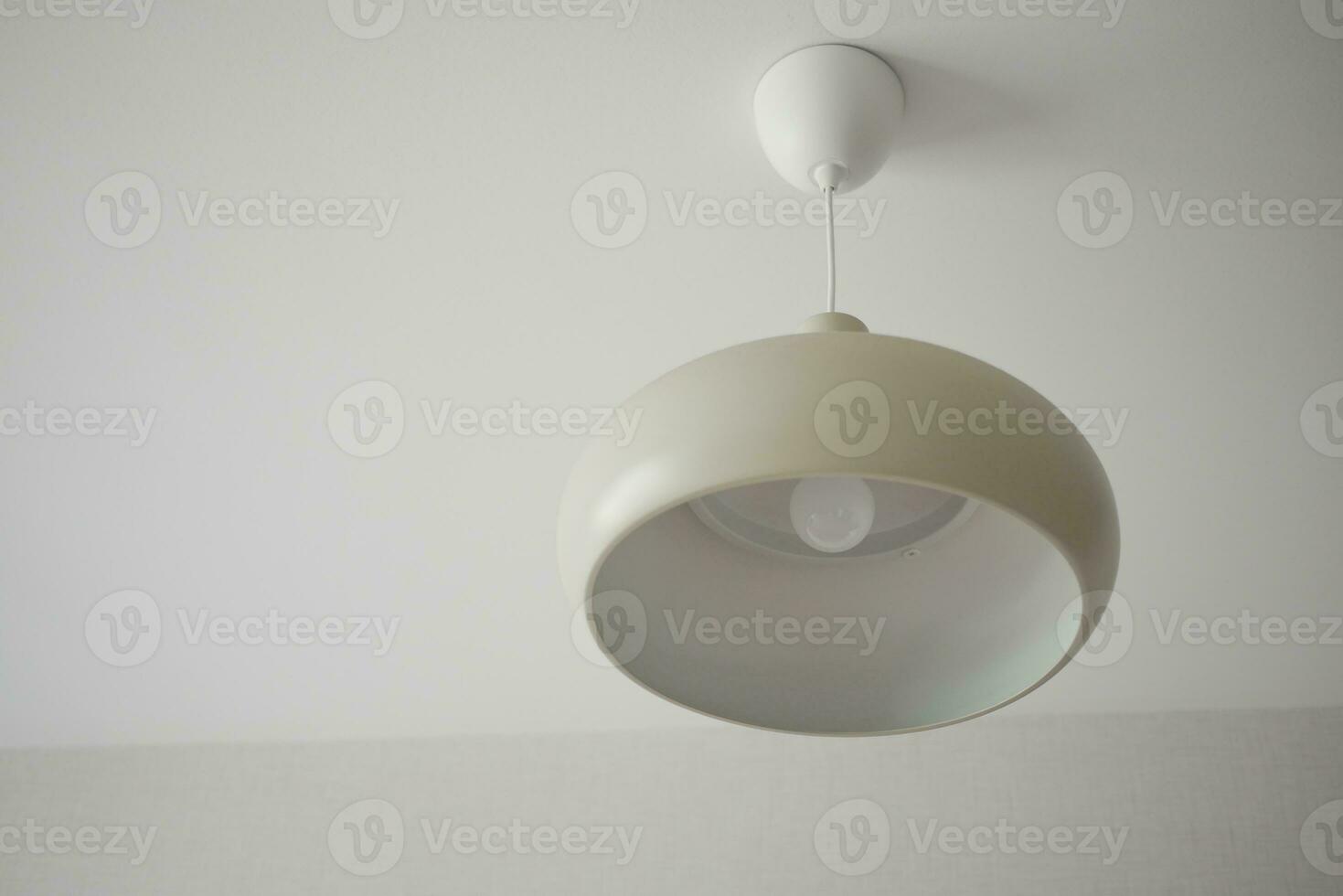 colorful ceiling lamp hanging in a room , photo