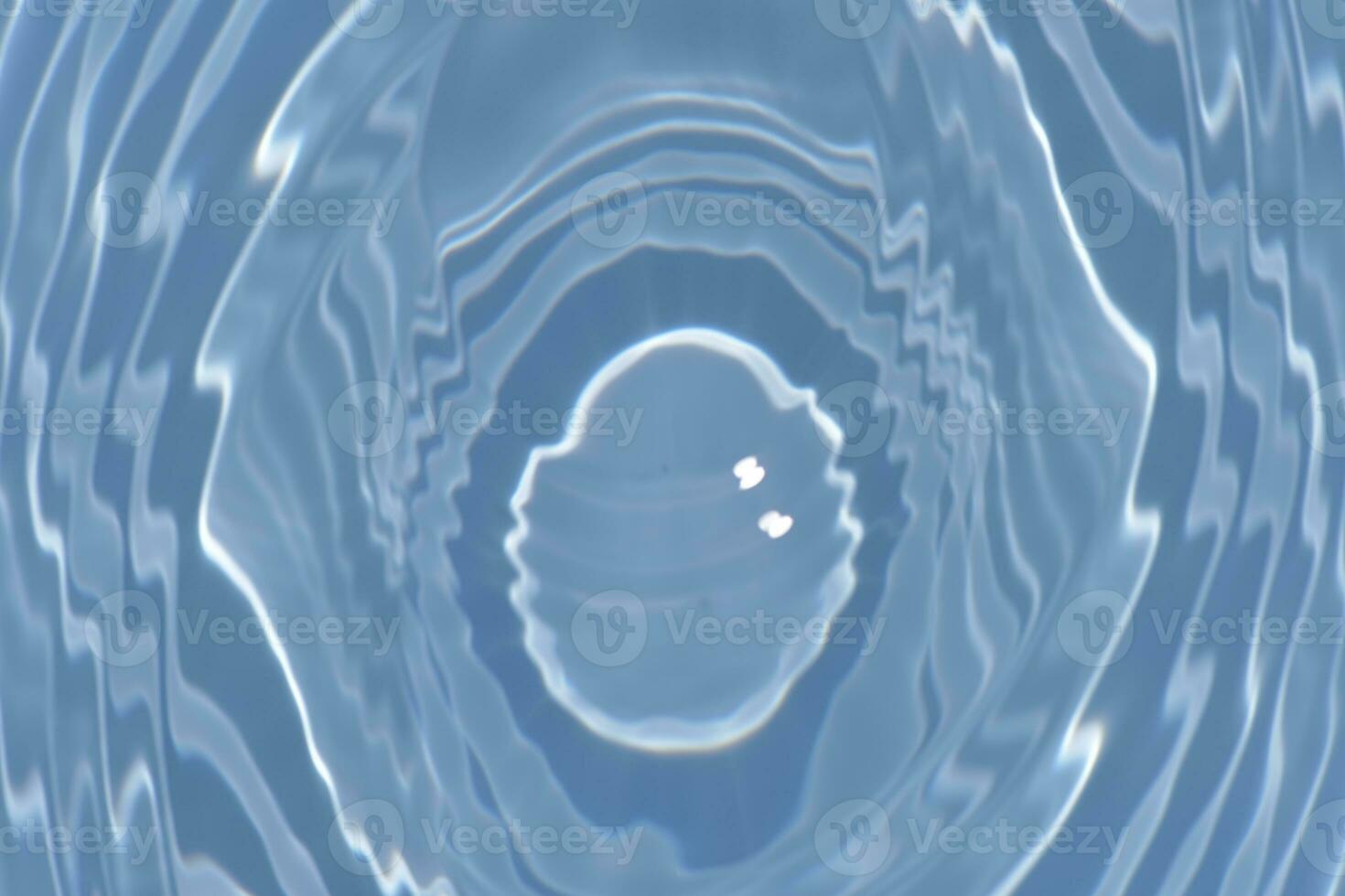 Defocus blurred transparent blue colored clear calm water surface texture with splashes reflection. Trendy abstract nature background. Water waves in sunlight with copy space. Blue watercolor shine. photo