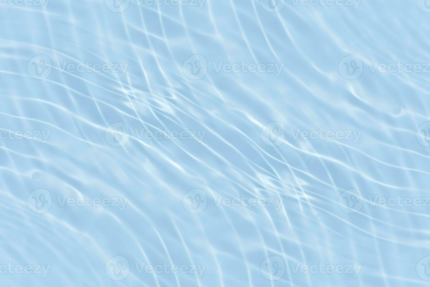 Defocus blurred transparent blue colored clear calm water surface texture with splashes reflection. Trendy abstract nature background. Water waves in sunlight with copy space. Blue watercolor shine. photo