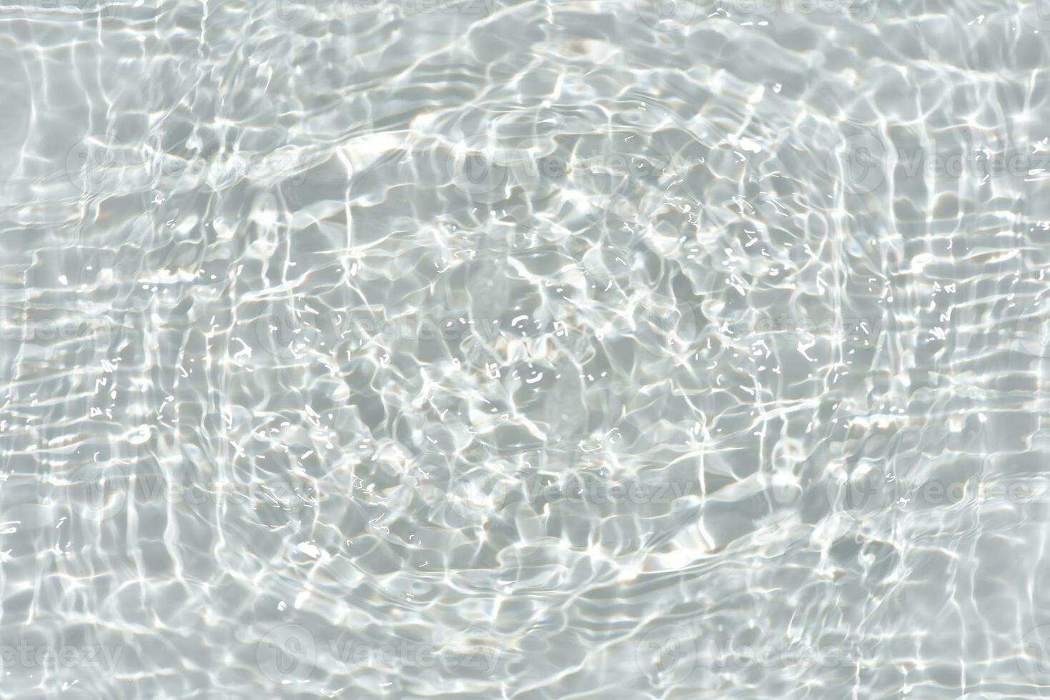 Defocus blurred transparent blue colored clear calm water surface texture with splashes reflection. Trendy abstract nature background. Water waves in sunlight with copy space. Blue watercolor shine. photo