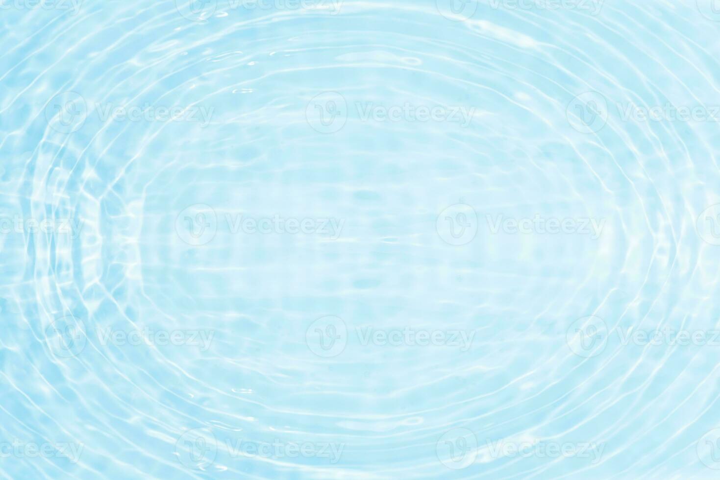 Defocus blurred transparent blue colored clear calm water surface texture with splashes reflection. Trendy abstract nature background. Water waves in sunlight with copy space. Blue watercolor shine. photo