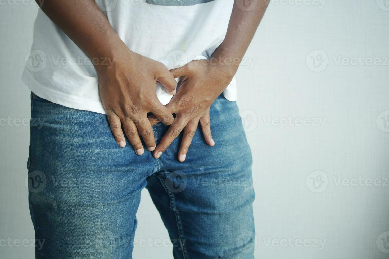 the concept of prostate and bladder problem, crotch pain of a young person photo