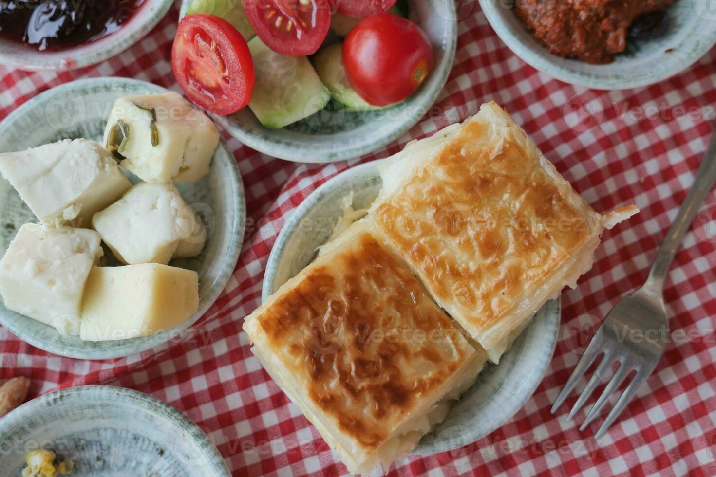 Traditional Turkish Cuisine Pastries and olive on table photo