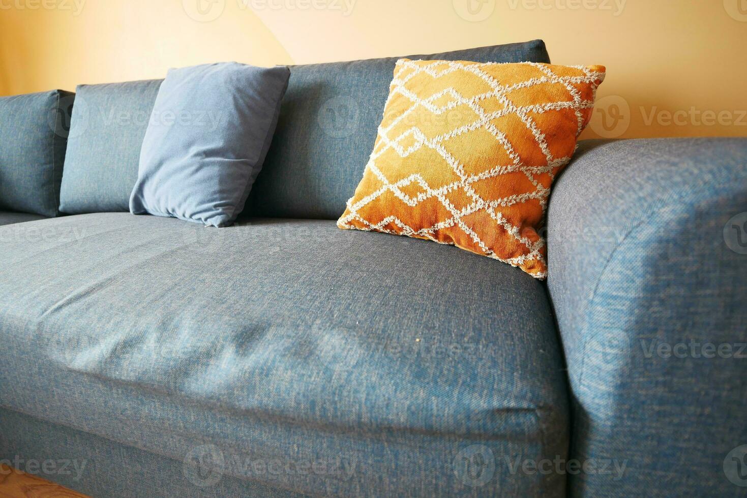 modern sofa with pillows in living room at home photo