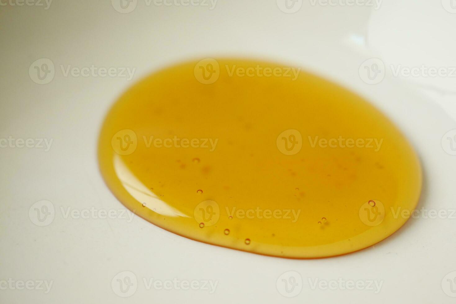 Honey isolated on white background, top view photo