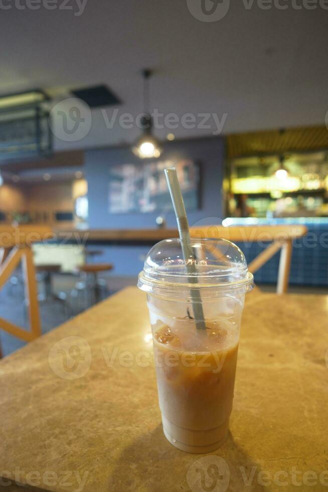 iced late in a transparent glass on cafe table outdoor photo