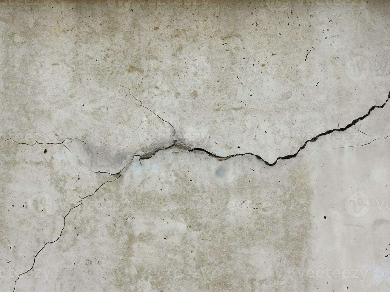 concrete wall with scratches and cracks photo