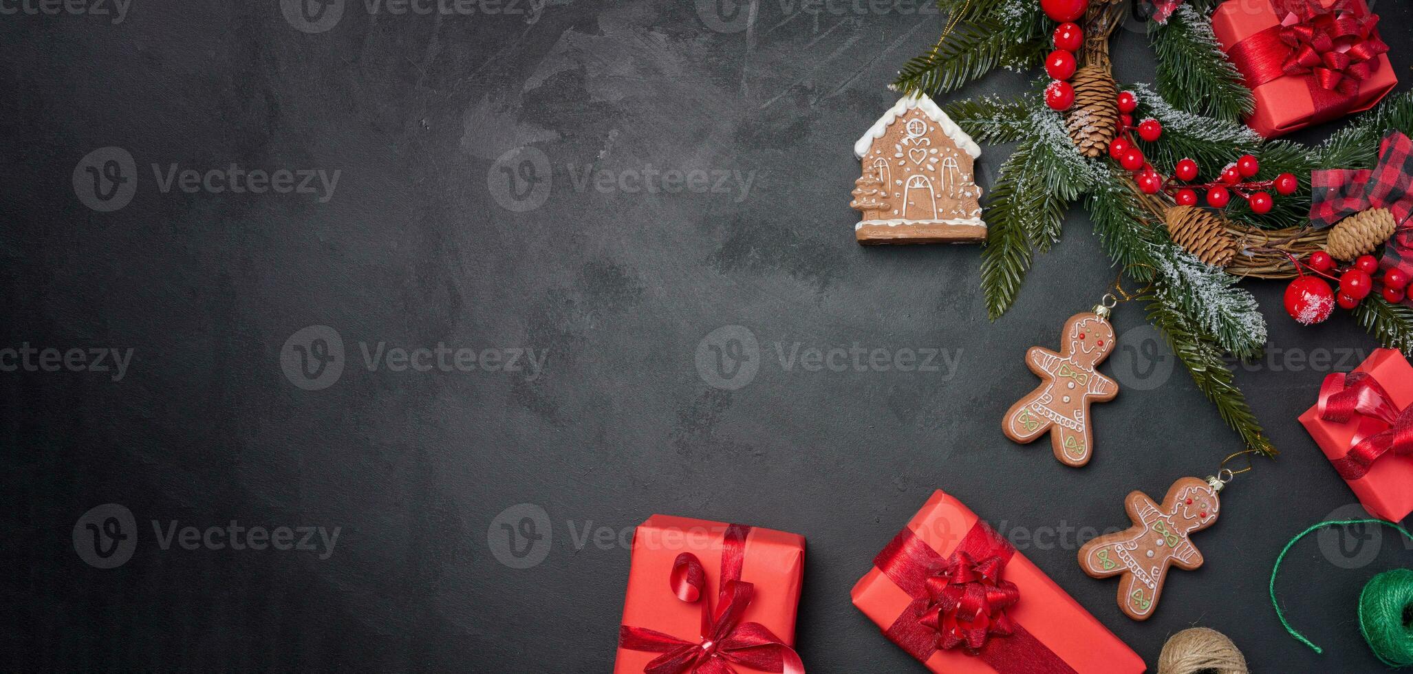 Christmas decor, gift red boxes on a black background, top view. Place for inscription photo