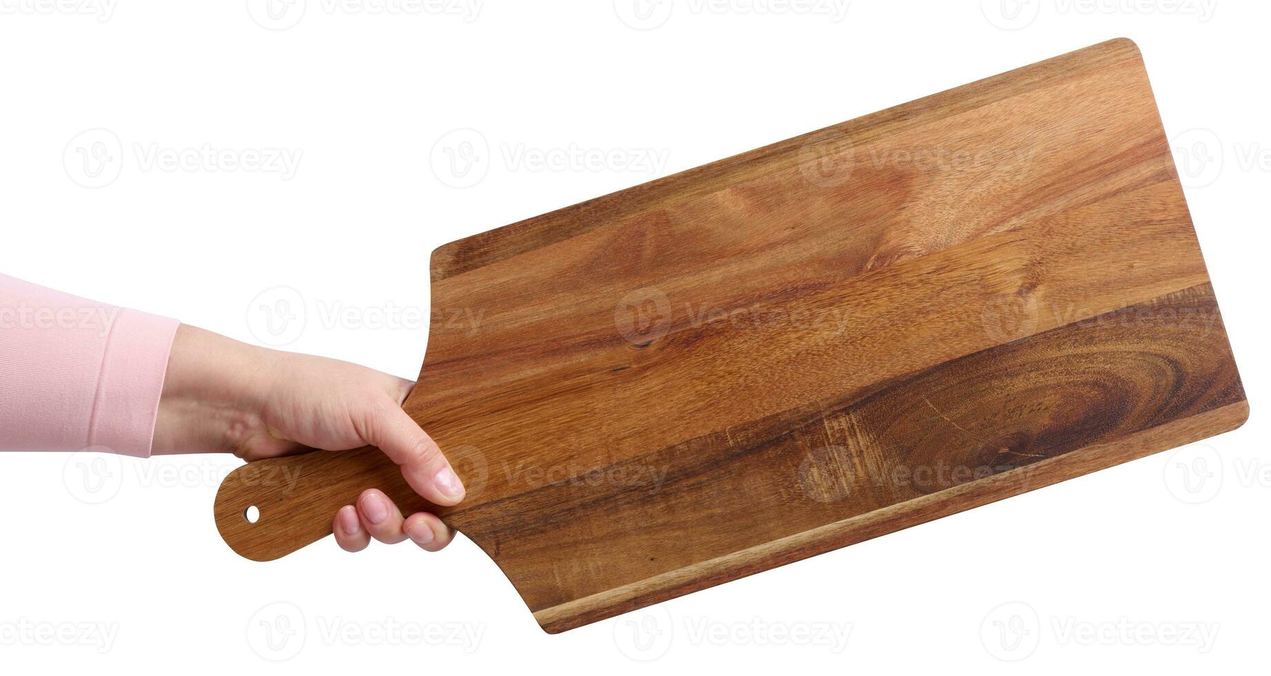 Female hand holding a rectangular wooden cutting board kitchen board photo