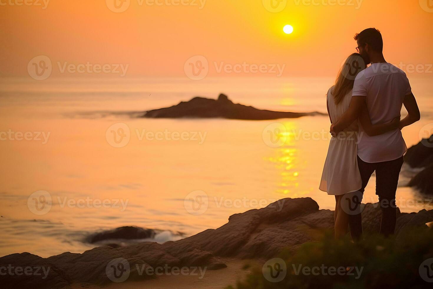 Caucasian couple hugging each other at beach during sunset photo