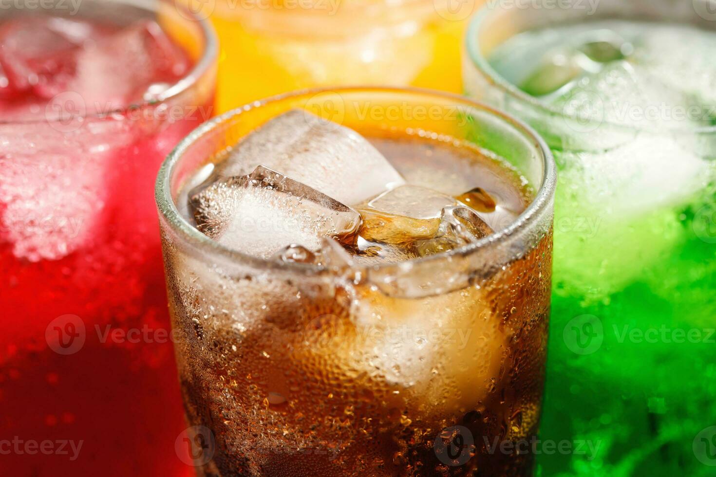 Soft drinks and fruit juice mixed with soda high in sugar have a negative effect on physical health photo