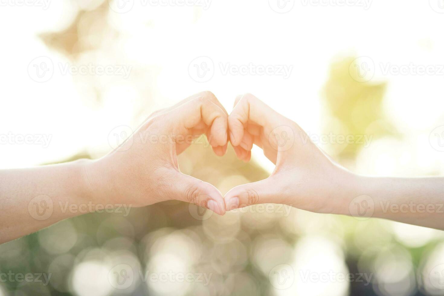 Couple lovers romantic holding hands towards with bright sun flare in public parks, or close up view in a conceptual image first love adolescent young relationship. lover photo