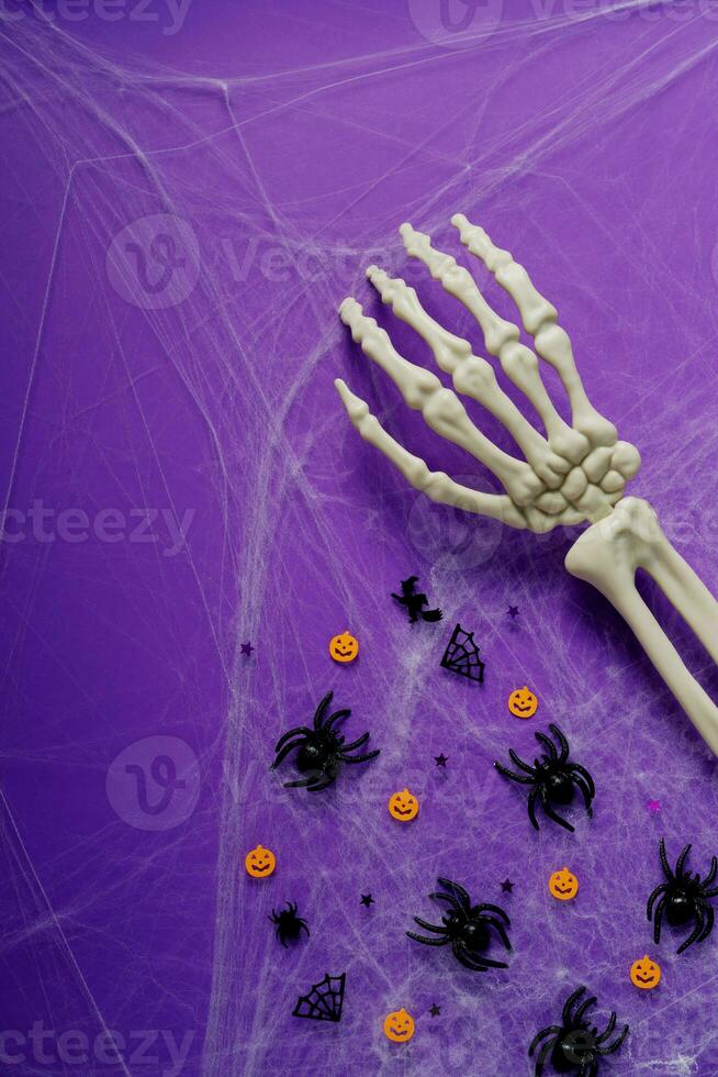 Happy Halloween banner mockup, pumpkins, bats and spiders on purple background photo