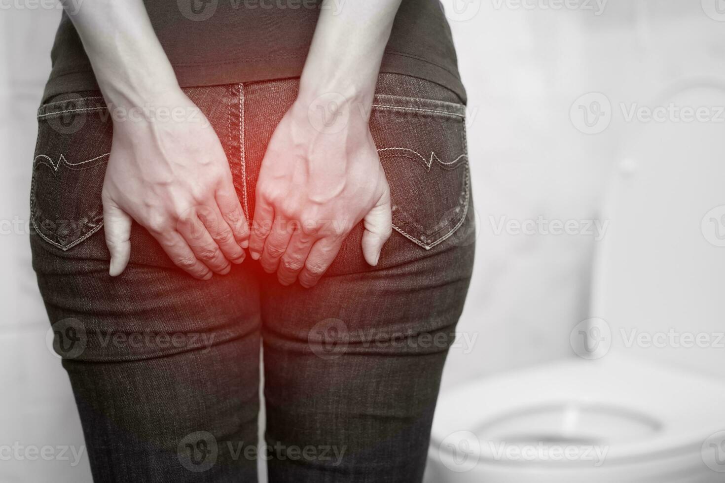 concept of health problems woman has hemorrhoids photo