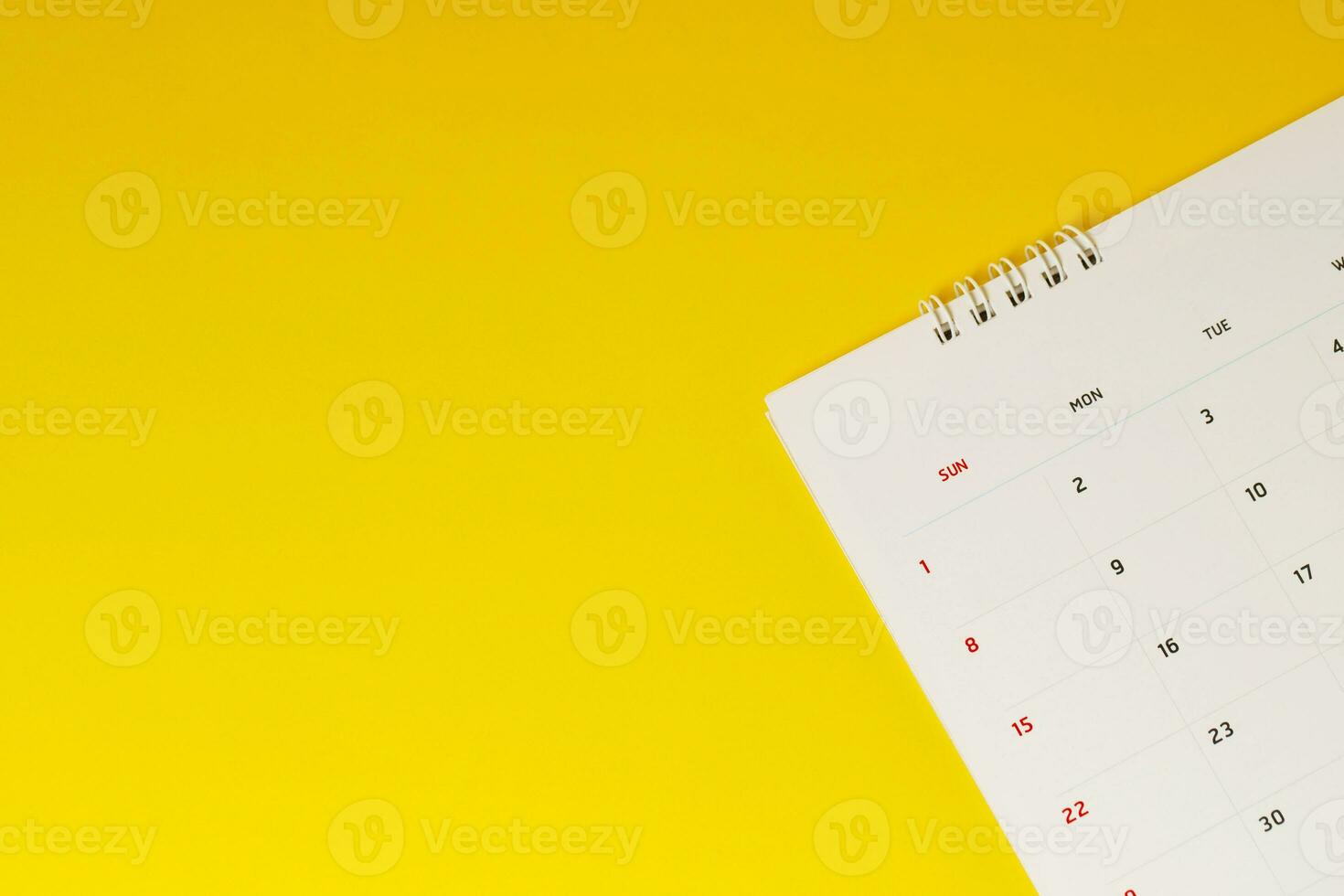 close up top view calendar 2020 month december end of the year schedule to make appointment meeting or manage timetable each day lay on yellow background for planning work and travel concept. photo