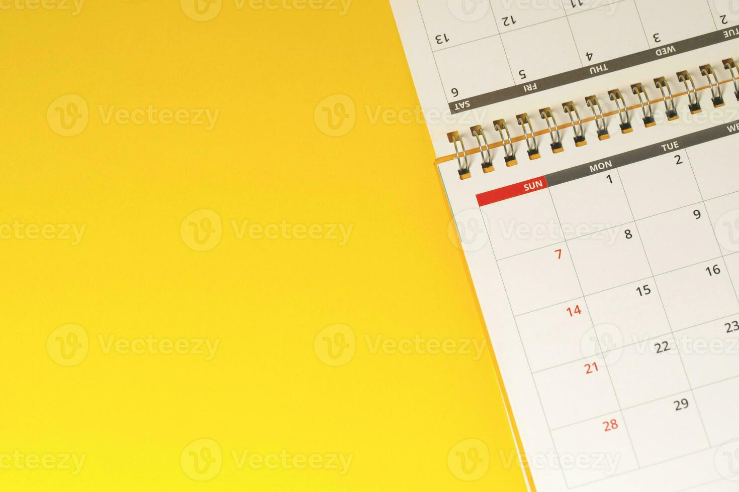 close up top view calendar 2020 month december end of the year schedule to make appointment meeting or manage timetable each day lay on yellow background for planning work and travel concept. photo