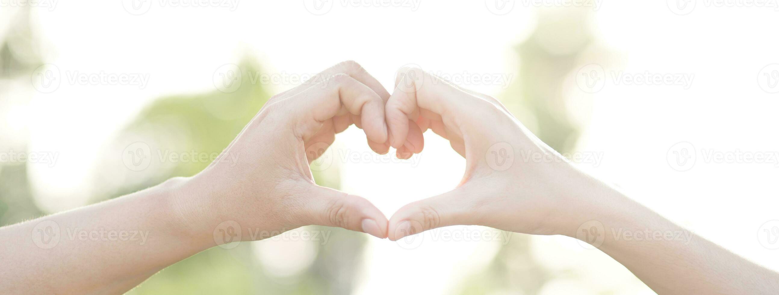 Couple lovers romantic holding hands towards with bright sun flare in public parks, or close up view in a conceptual image first love adolescent young relationship. lover photo