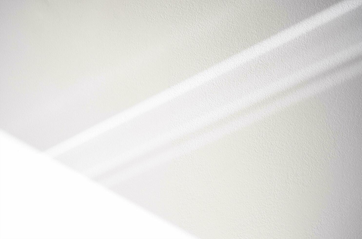 White wall concrete texture with bright light and abstract drop diagonal shadow on white plaster paint on concrete floor,Light effect for Monochrome photo,mock up,poster, wall art,design presentation photo