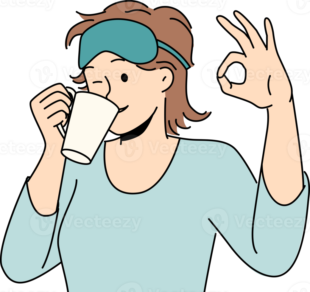 Woman drinks morning coffee after waking up and shows ok gesture standing in sleep mask png