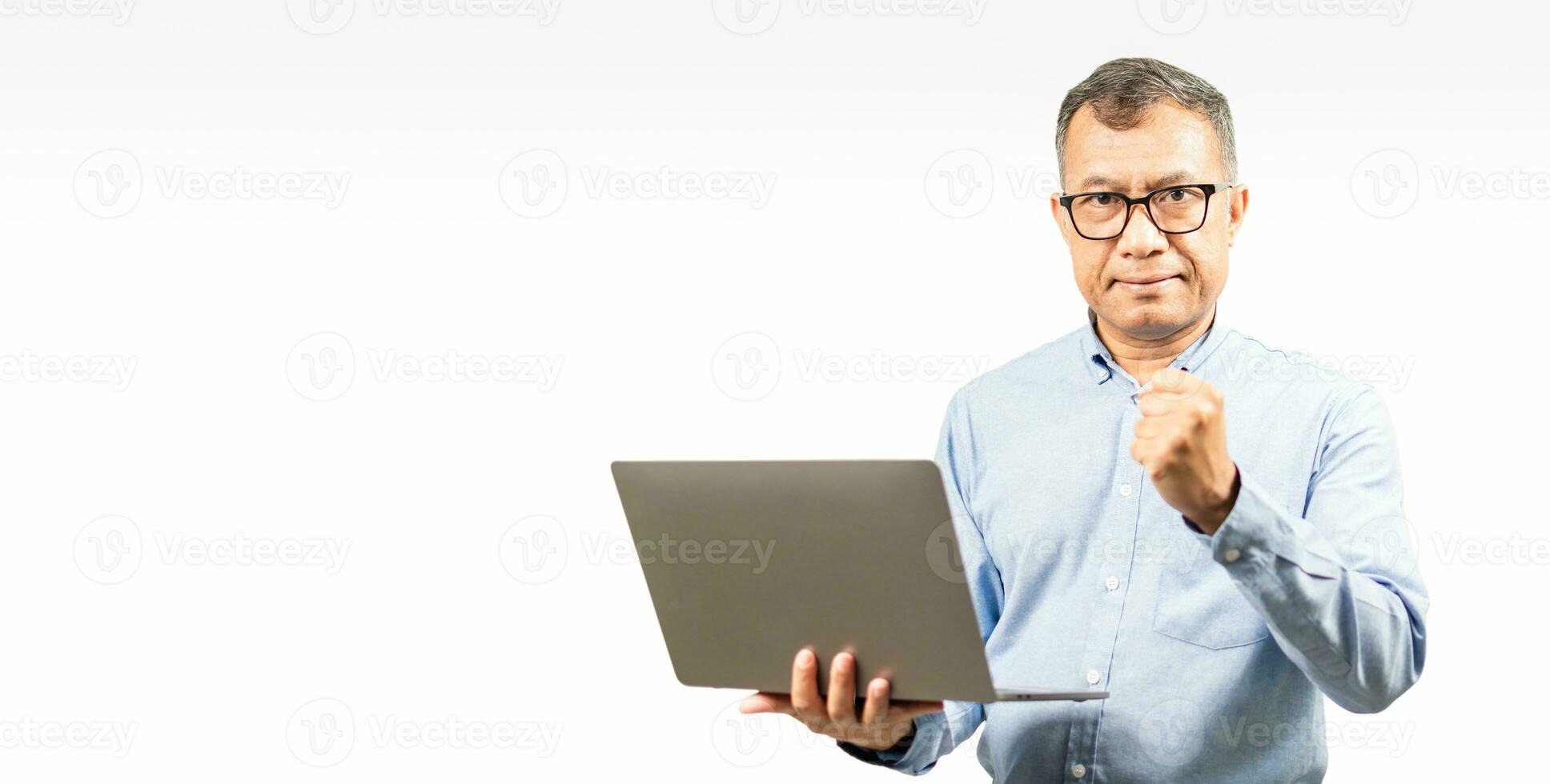 Selective focus, Businessmen look at camera and express their joy with the growth of their business from laptops. man holding a notebook computer and working on financial, copy space, white background photo