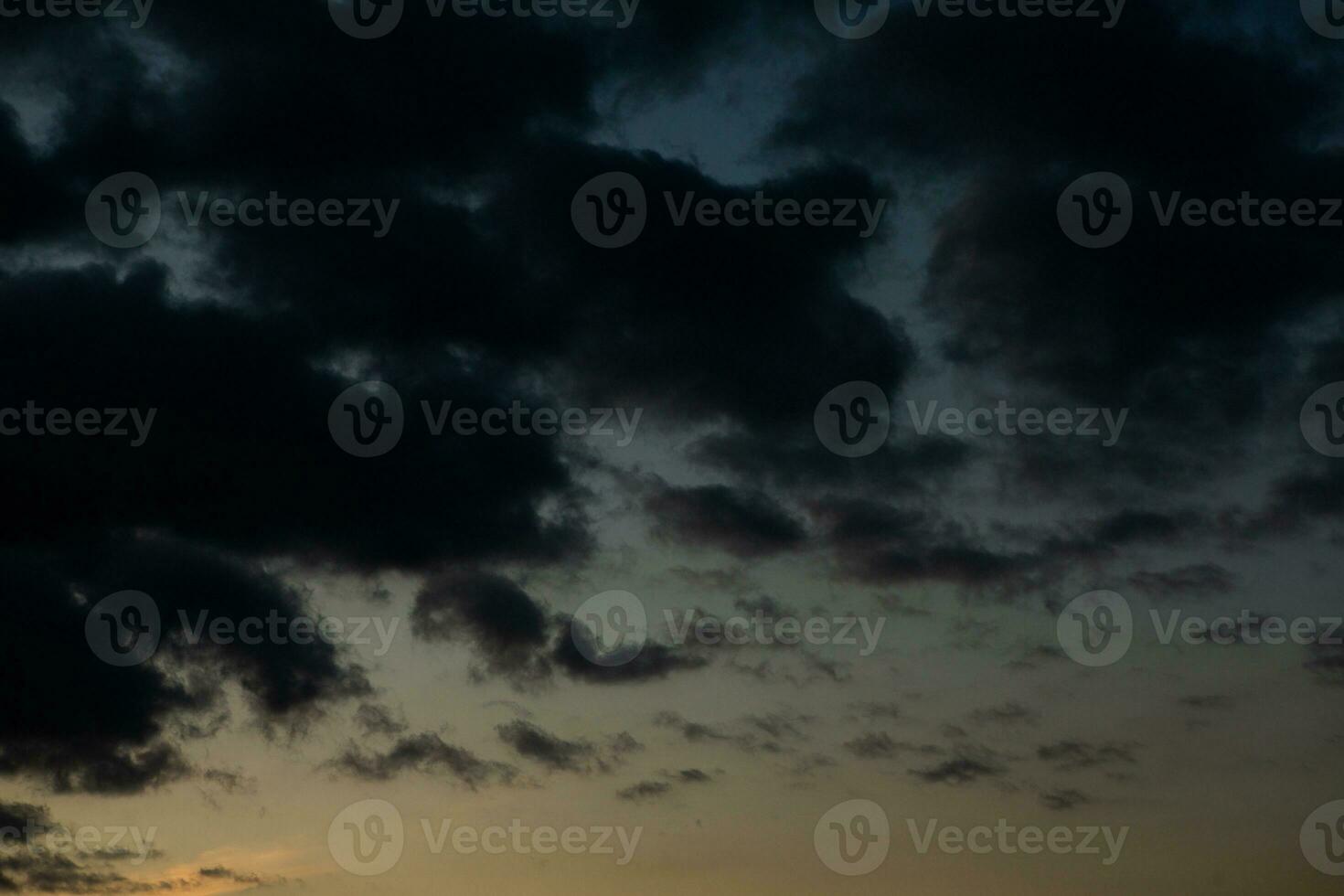 Stormy sky with dark clouds. Natural background. Sky background. Cloudscape, Colored Sunset. photo
