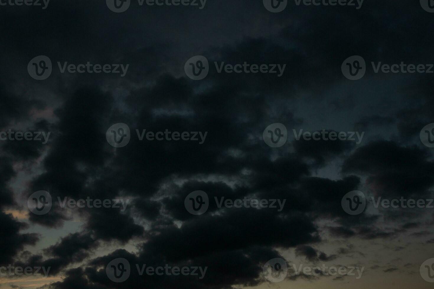 Stormy sky with dark clouds. Natural background. Sky background. Cloudscape, Colored Sunset. photo